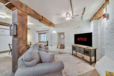 Queen Pullout couch -located in the open concept living room