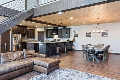 - Open concept living and dining with rustic charm  
- Granite bar seating connects to spacious kitchen  
- Cozy leather sectional perfect for group gatherings