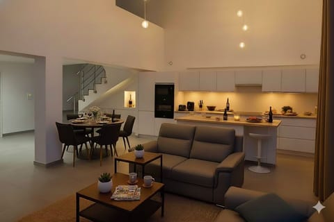 Spacious open-plan living, dining, and kitchen area ideal for groups.