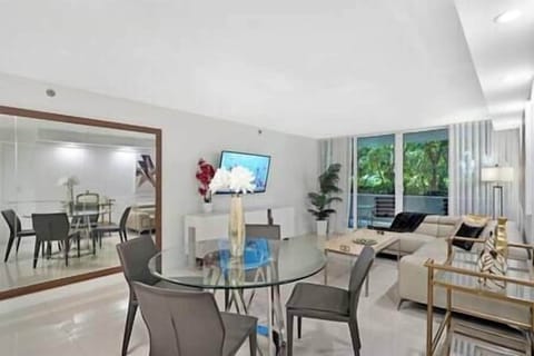 Dining area, living area with patio access and Roku streaming tv