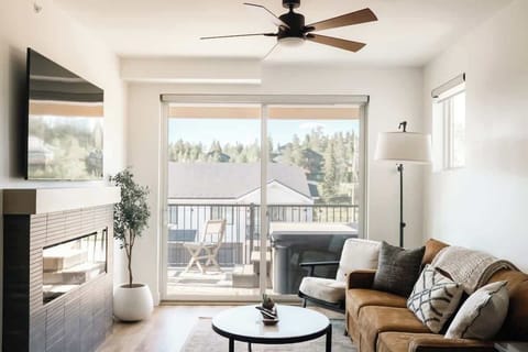Living area with balcony exit to the hot tub