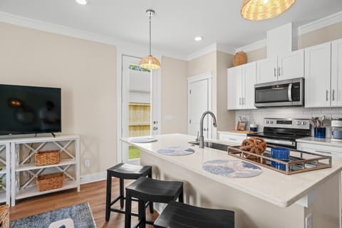 Side door leading to fenced in yard and pool