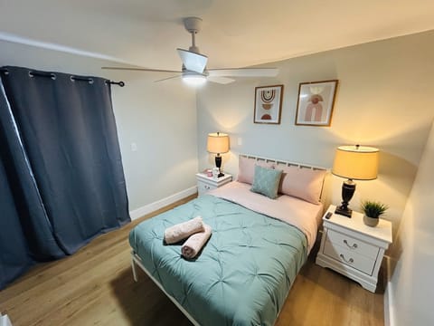 Enter our cozy bedroom 1, featuring a cozy Queen-size bed and a practical smart TV for you and a compact closet for your storage. The simplicity of the space ensures a comfortable atmosphere, making it a laid-back retreat after a long day.