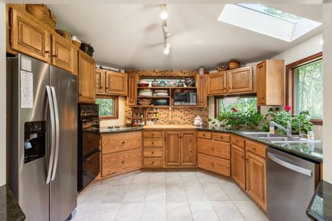 The kitchen is fully stocked and features new appliances and tons of counter and cabinet space.