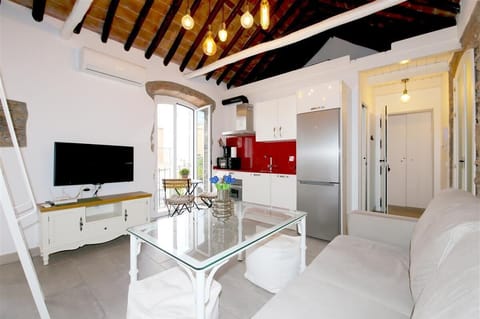 Bright and modern lounge area with open kitchen to the rear