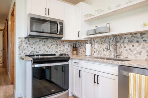 Full size microwave, stove and oven.