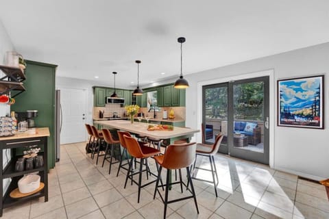 Spacious island table seating 10 comfortably, perfect for family meals and gatherings.