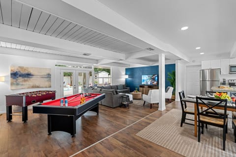 The entire recreation area is thoughtfully integrated into the living space, allowing for easy transitions between lounging and playing.