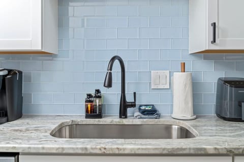 Prepare and cook your preferred dishes in this fully-equipped kitchen, stocked with all essential cooking utensils