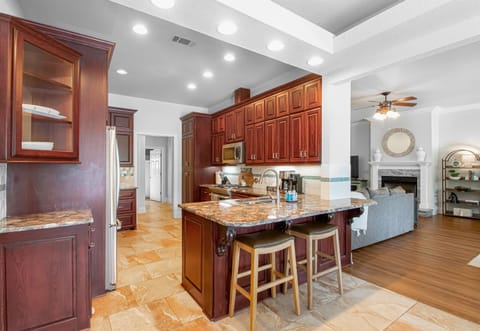 Another view of the spacious kitchen showcases its functionality and stylish design.