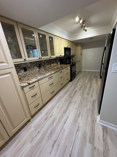 Stove, fridge, freezer with ice maker, microwave, & dish washer.