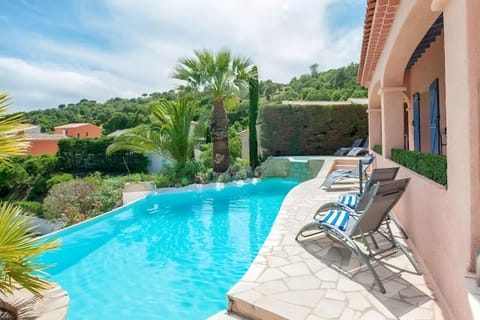 Enjoy a refreshing dip in the private pool, surrounded by lush greenery and the villa's charming stone patio. Relax on one of the lounge chairs and soak in the stunning view of the surrounding hills and the Mediterranean Sea in the distance.  The pool can