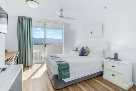 Sleep easy in the queen-sized bed. It comes set with crisp white linens, side tables and reading lights with direct access to the balcony. 
