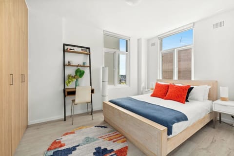 The spacious, light-filled first bedroom features a queen-size bed, while a desk provides a space to work or study. A portable AC/heater is provided for your comfort.
