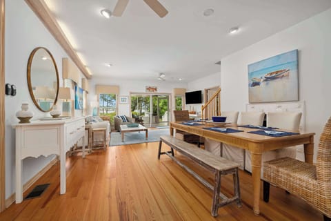 One of two dining areas, which opens up to one living room and a screened-in porch. 