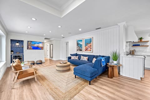 Soft seating, curated design, and a large-screen TV create the perfect place to unwind, whether it's movie night or morning coffee with the news.