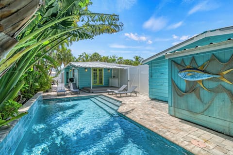 Slip into sun-drenched serenity—your private heated pool is the definition of beachside bliss.