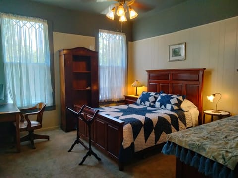 Bedroom #2 with queen bed, desk and TV