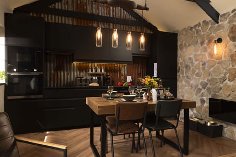 The Old Dairy, Carnhell Green, Hayle: Feature lighting completes the space, incorporating an 18th century carved milk maid carrier and old-fashioned milk bottles