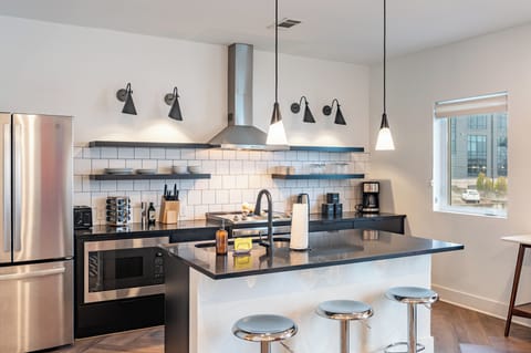 A stylish, well-equipped kitchen where modern design meets everyday comfort.