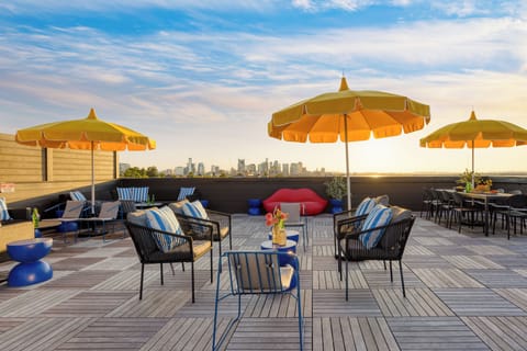 Sip cocktails on the rooftop with breathtaking sunset views.