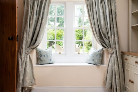 Charming interiors with traditional sash windows, looking out onto front garden