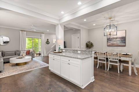 A huge open kitchen is situated right in the middle of the dinning and living areas.