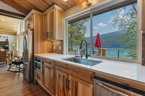 Doing dishes is a serene experience. Pass through window w outdoor shelf.