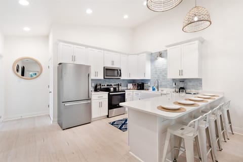 Five barstools provide ample seating for guests to gather, dine, and enjoy great company.