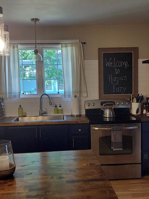 Kitchen with stove, dishwasher, disposal, microwave, & 3 kinds of coffee makers!