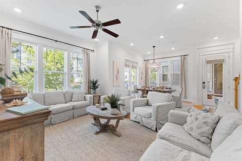 Relax in a bright and airy living space with soft coastal tones and elegant beach-inspired decor.