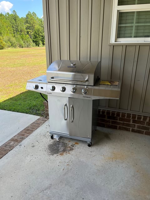 Propane 4 burner grill. Propane is provided along with cleaning supplies 