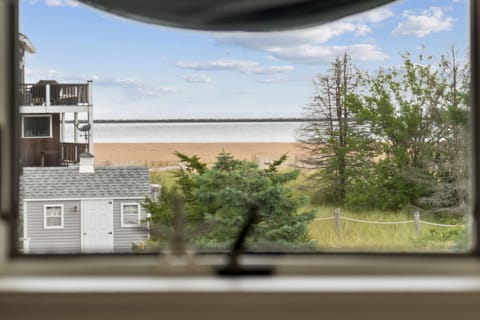 Ocean views from primary bedroom windows over the bed!