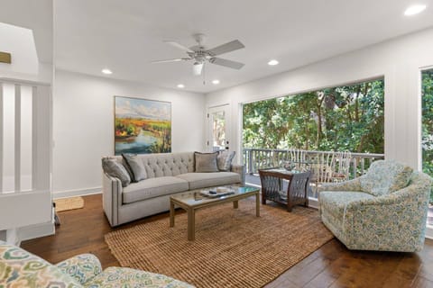 Just off of the living room is access to a spacious back deck nestled in the trees. You'll have views of the 2nd tee box of the Sea Palms golf course.