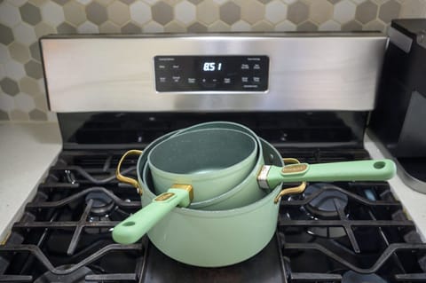 Pots and gas stove for preparing delicious meals.