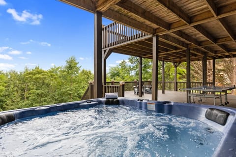 Enjoy the ultimate relaxation experience in the hot tub on the deck, overlooking breathtaking scenery