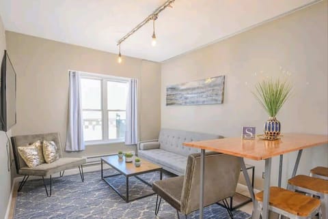 Bright living room with 55" smart TV.