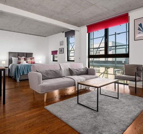 Stretch out in your bright, open-plan living space with canal views flooding in through floor-to-ceiling windows