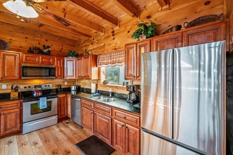 The kitchen includes stainless steel appliances a full suite of supplies.