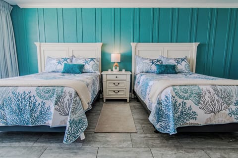 Two comfy queen beds to fall asleep to the sound of the ocean!