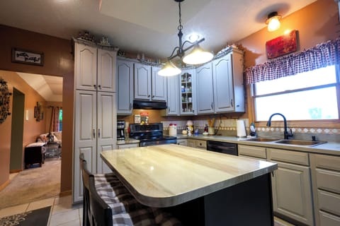 Large Kitchen Island Offfers Another Gathering Spot