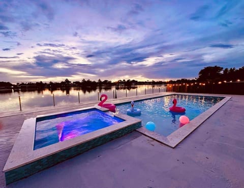 Premium  lakefront retreat with a heated pool and epic sunset views.  #Aventura #LakefrontLiving 