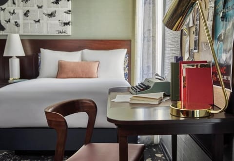Unwind beside the sleek desk and cloud-soft bed linens.