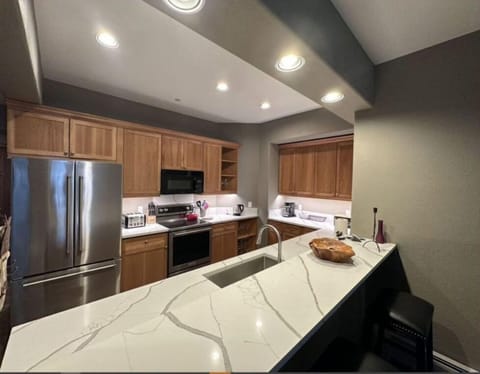 Prepare meals in style in our modern kitchen, complete with sleek countertops, stainless steel appliances, and plenty of workspace. Perfect for culinary enthusiasts.