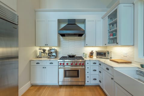 Wolf 6-burner gas range, dishwasher, and standard drip style coffee maker with coffee grinder