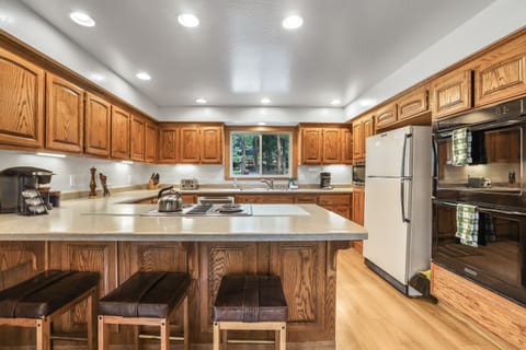 Large kitchen with seating for 3 at the bar.