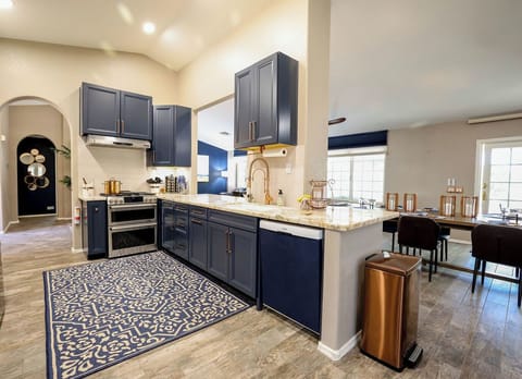 Kitchen with GE CAFE gas cooktop, griddle, dbl oven. Sink with RO water filter