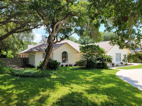 This private retreat is just steps from the beach and the river