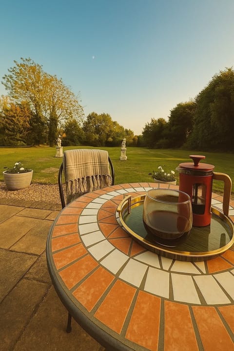 Early evening coffee on the terrace with a blanket  as the sun goes down