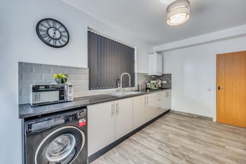 Kitchen area with coffee machine